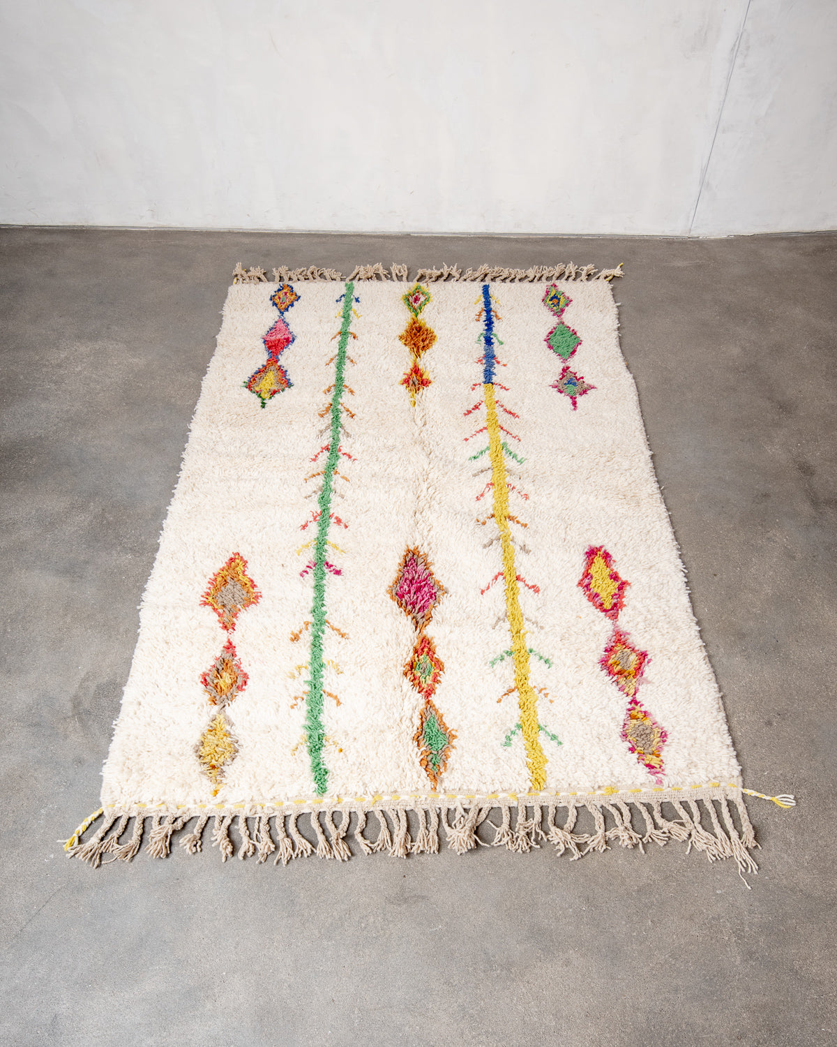 Modern, designer, handcrafted Berber runner rug from Morocco. Beniourain carpet with beautiful colours and patterns and fluffy wool texture.